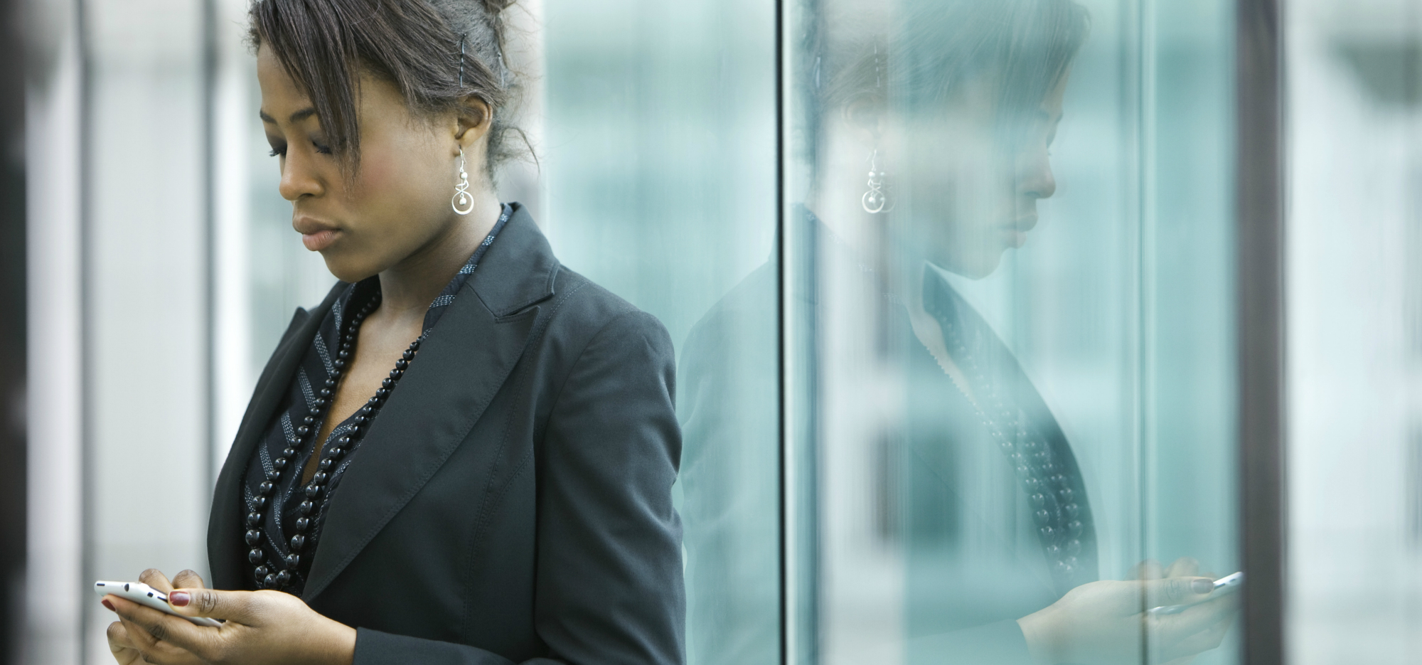 Woman reflected in glass